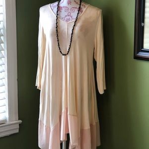 Light peach, silky hemmed tunic.